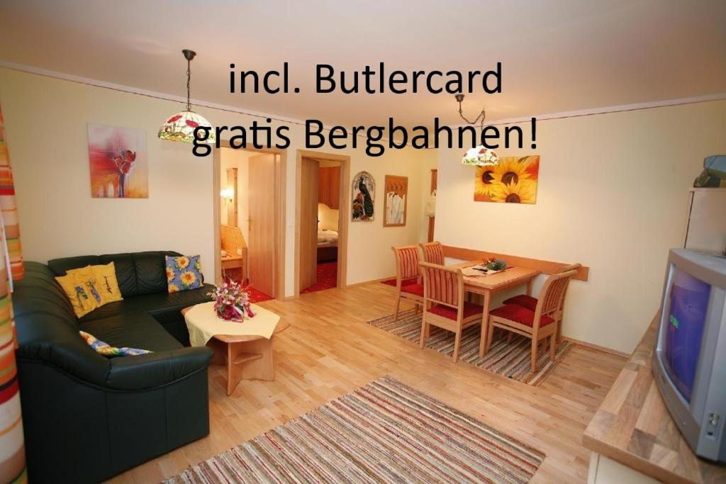 a living room with a couch and a table at Ritas Alm in Turracher Hohe