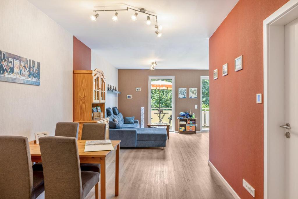 a living room with a couch and a table at Ferienwohnung "Beim Tannenbaum" in Reichensachsen