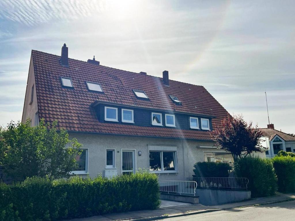 a house with a red roof on a street at Stadtquartier Soest in Soest
