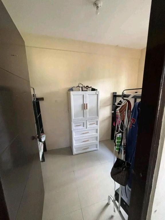 a room with a closet with a white cabinet at Familia homes in Lipa