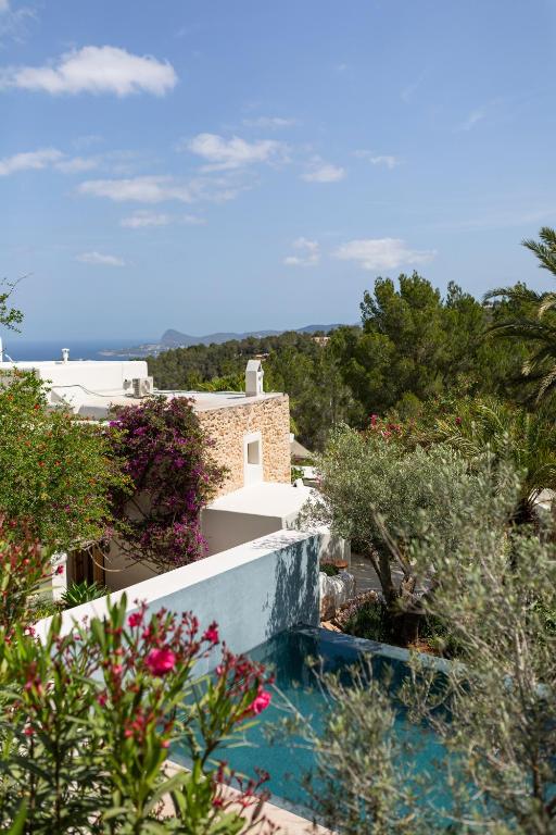 a view of a villa with a swimming pool at Boutique Hotel Jardines de Palerm in San Jose