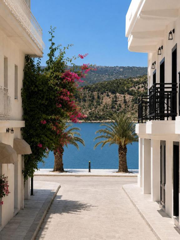 a view of a lake from between two buildings at Anoi Kefalonia in Argostoli