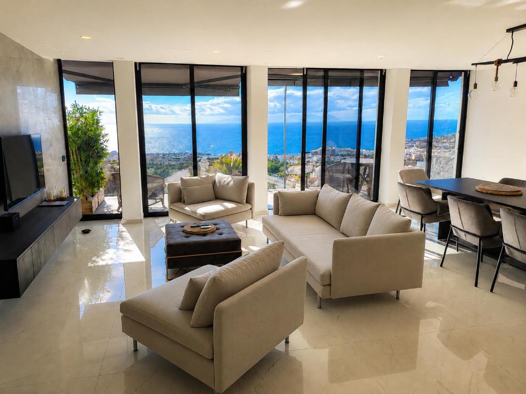 a living room with couches and a table at Villa de Anna in Adeje