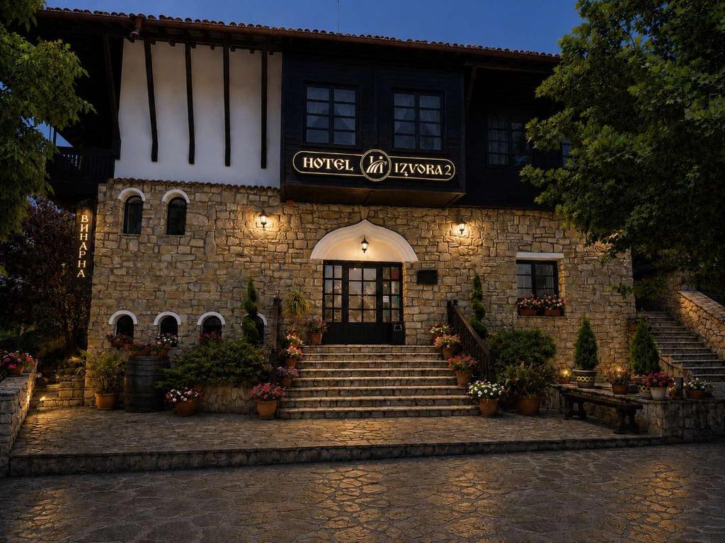 a building with stairs leading to the front door at Hotel Izvora 2 in Arbanasi