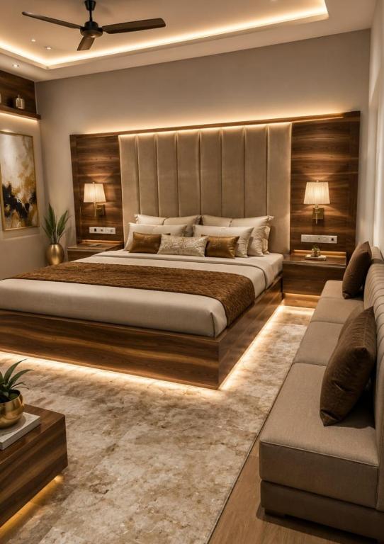 a large bedroom with a large bed and a couch at Green valley resort kanha in Kānha