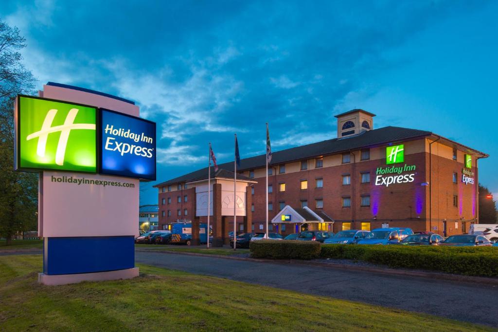 a building with a sign in front of it at Holiday Inn Express Birmingham Oldbury by IHG in Oldbury
