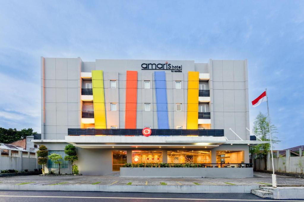 a building with different colored squares on it at Amaris Hotel Pekanbaru in Pekanbaru