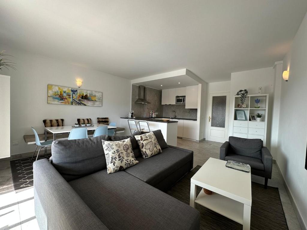a living room with a couch and a table at Teresita 2 in Empuriabrava