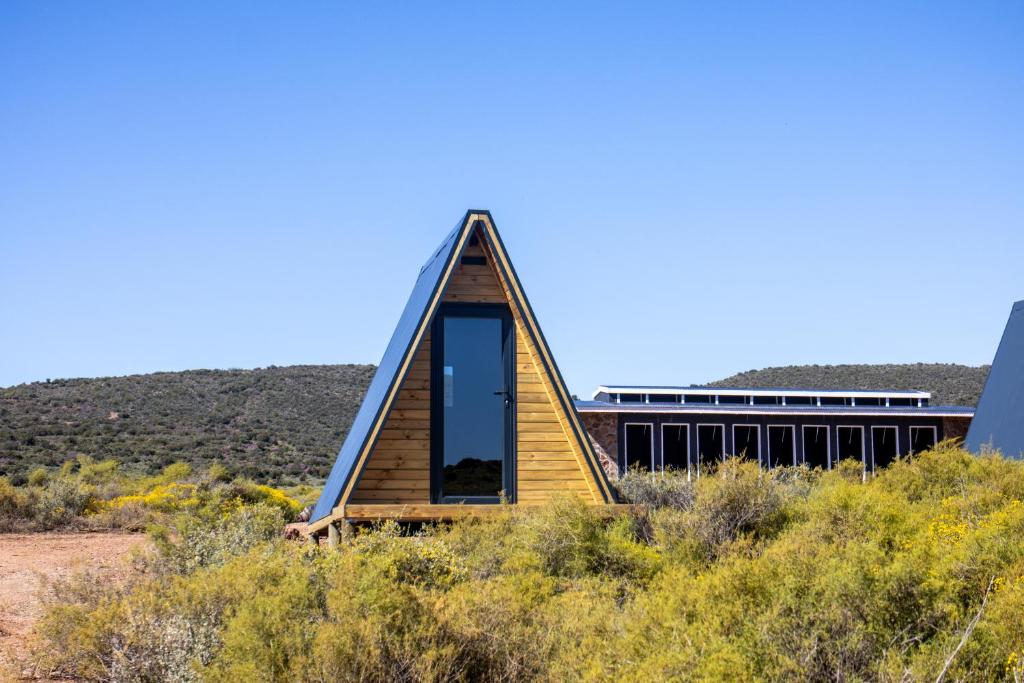 a triangular house in the middle of the desert at Karoo 62 Escape - A-frame in Ladismith