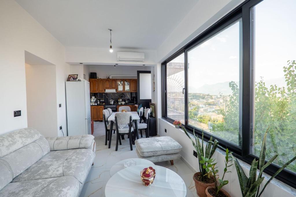 a living room with a couch and a table at Lina's House in Sarandë
