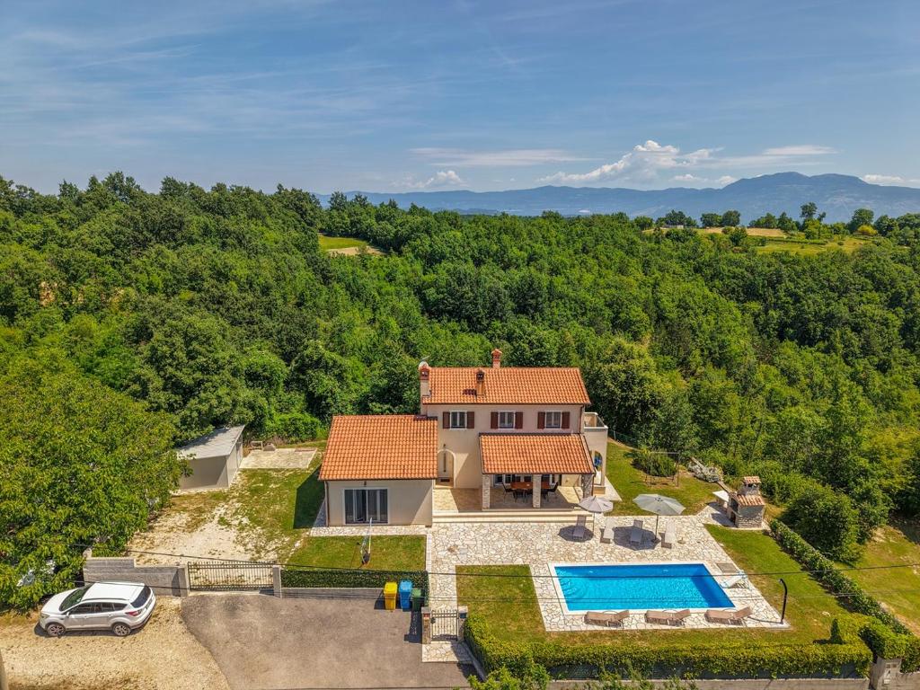 an aerial view of a house with a swimming pool at Villa Andretti in Gračišće