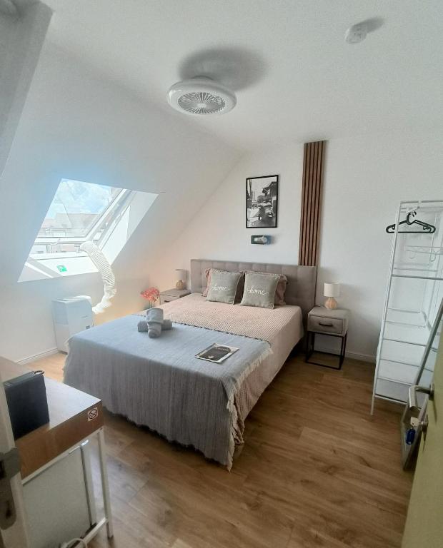 a bedroom with a large bed and a ladder at 2Bangkok residence in Ghent