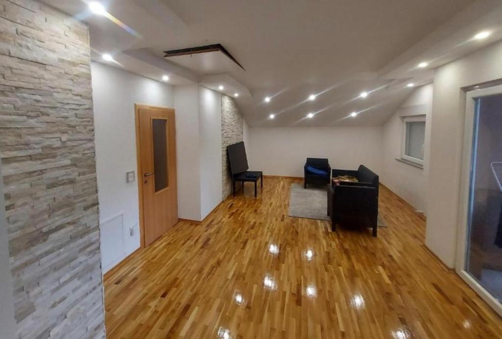 an empty room with a desk and chairs in a room at Apartments Tutto Bene in Jajce