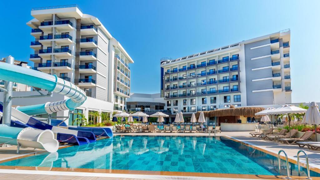 a pool at a resort with a water slide at Çenger Blue Collection Hotel Ultra All Inclusive in Manavgat