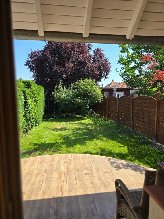 a view of a yard from a patio at Relax Apartman Gyula in Gyula