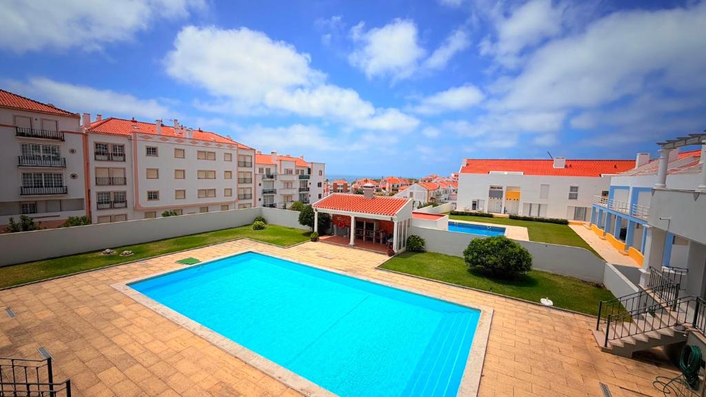 an overhead view of a swimming pool on a apartment at RIVABeach House in Lourinhã