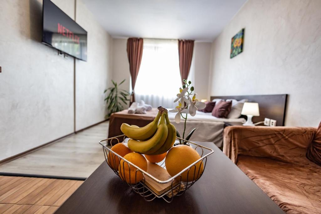 a bowl of fruit on a table in a living room at Snow Crystal Studio in Bansko