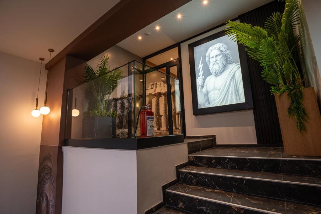 a building with stairs with a picture of a statue at Vila Hera Spa in Vrbas