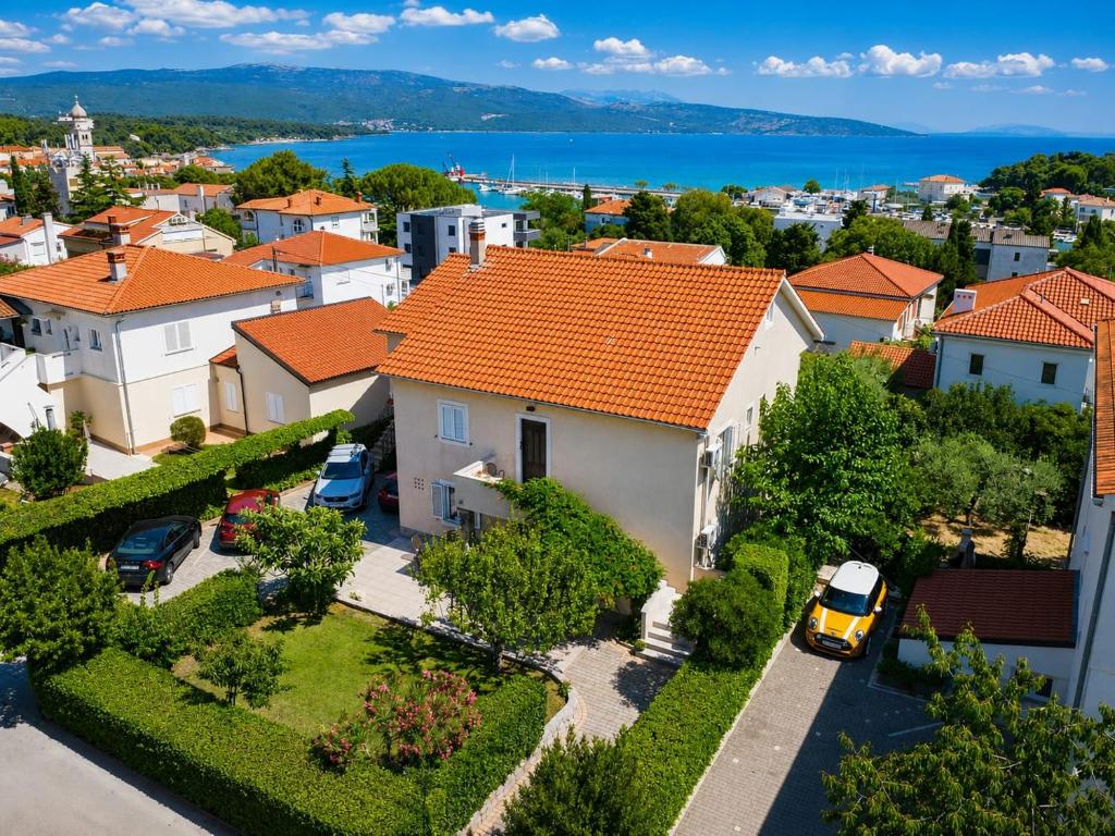 an aerial view of a house with orange roofs at Apartment Na broju3 in Krk