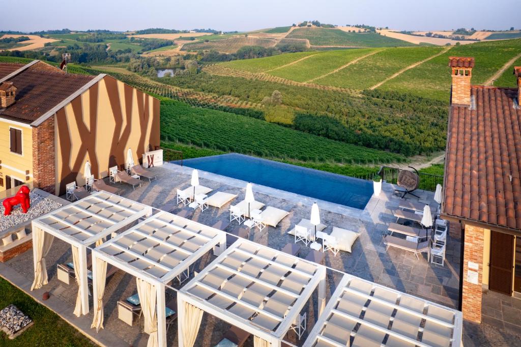 an aerial view of a villa with a swimming pool at Montalbera Wine Suites in Montemagno