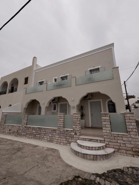 a building with steps in front of it at Rooms By Lignou in Fira