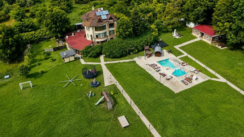 an aerial view of a house with a swimming pool at Комплекс Сборяна in Gramatikovo