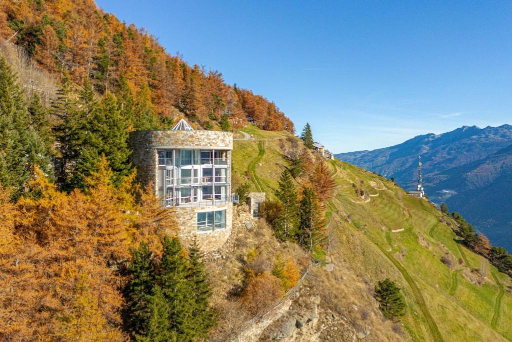 a house on the side of a mountain at Turm Chalet in Laces