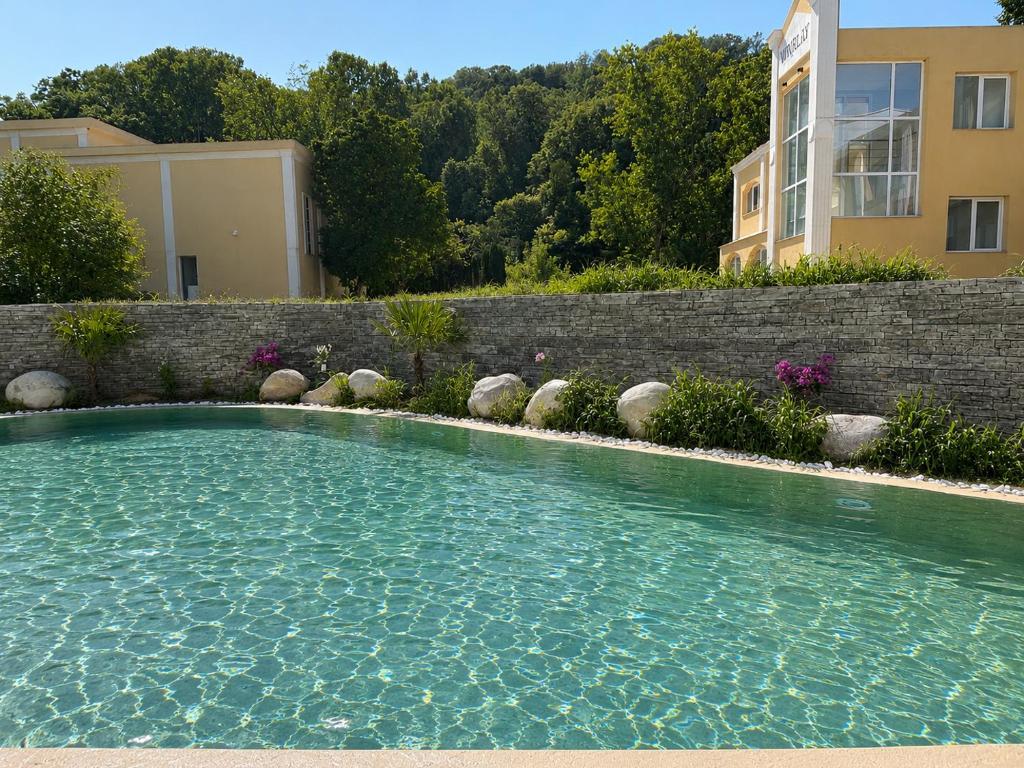 a swimming pool in front of a house at Teracite in Varna City