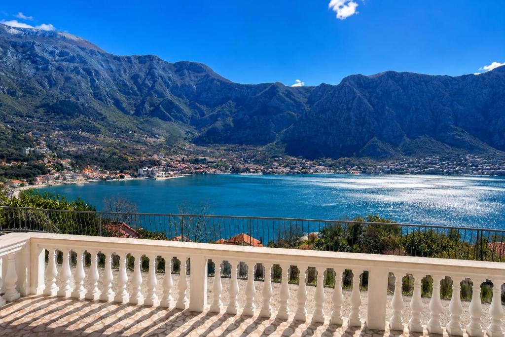 a balcony with a view of a lake and mountains at Villa SeaView Panorama in Risan