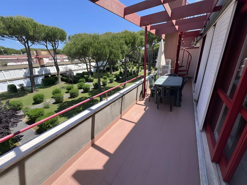 a balcony with a table and a view at Casa vacanze Heidi con piscina in Marina di Bibbona