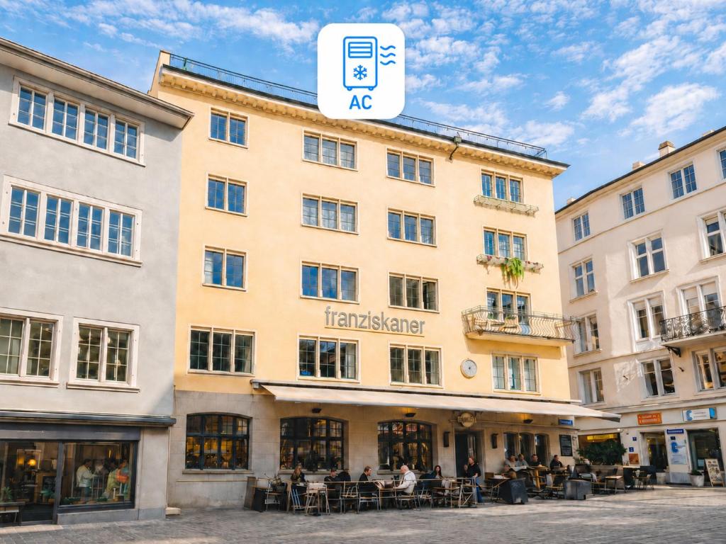 a building with a sign that reads tempelmaker at Franziskaner by Centra in Zurich
