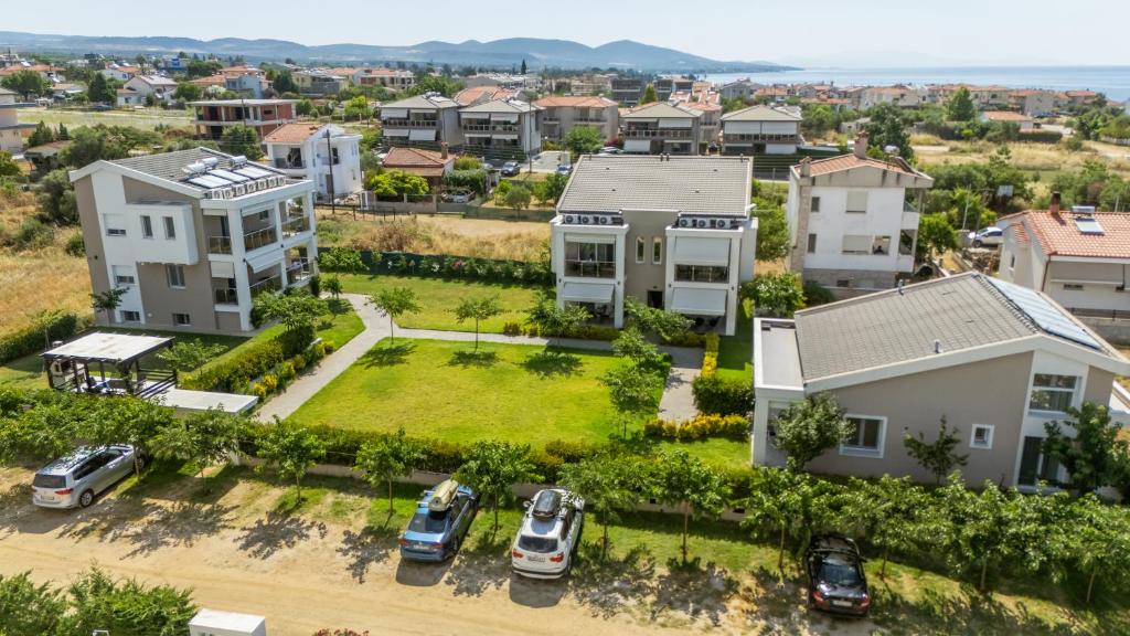 an aerial view of a residential neighborhood with houses at Bianco Mare Studios-Apartments in Kalives Poligirou