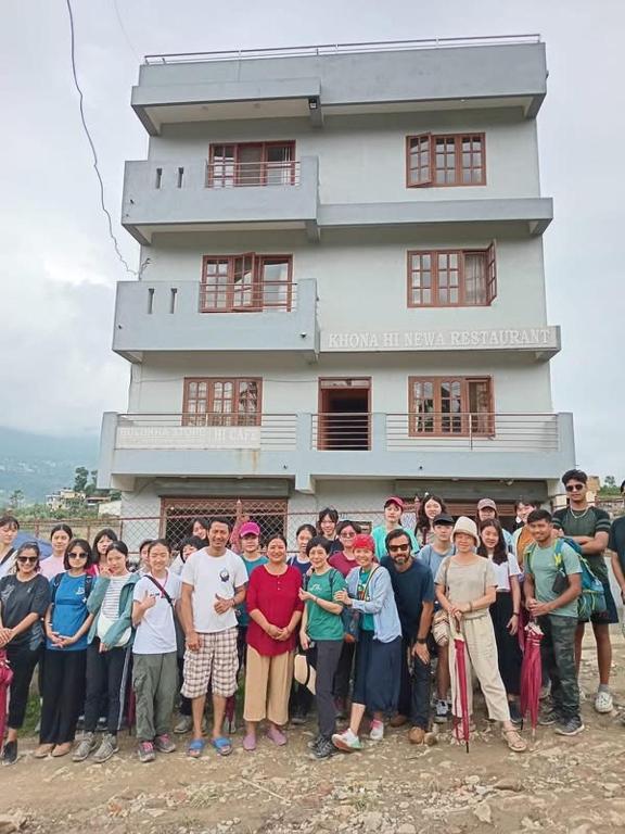 a group of people standing in front of a building at Hotel Himalayan Inn, khona in Pātan