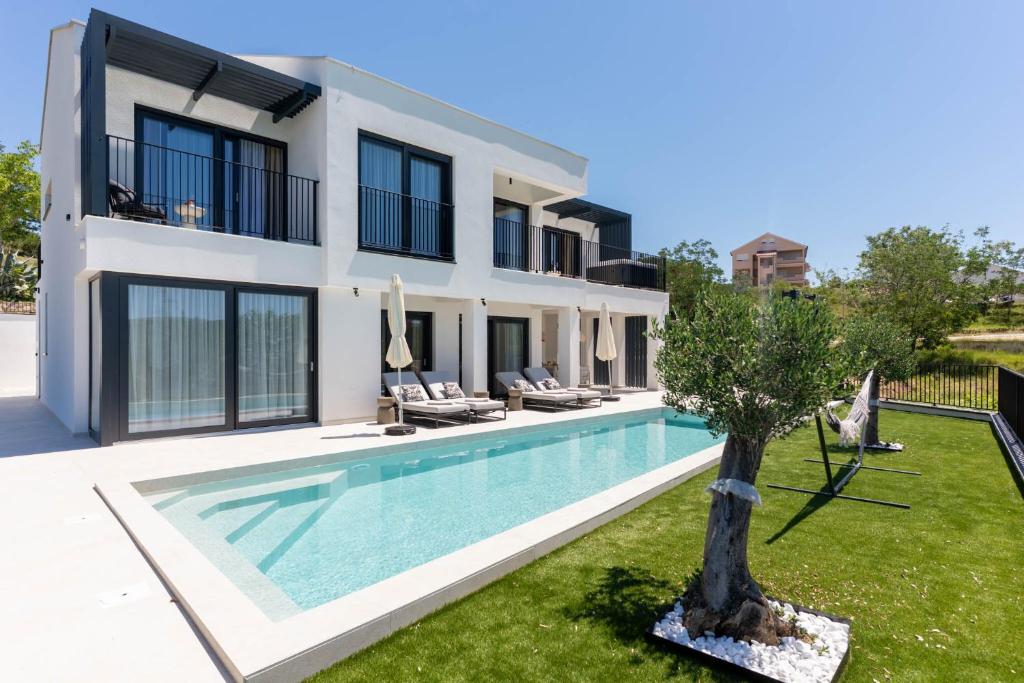 an image of a villa with a swimming pool at Villa Loparia in Lopar