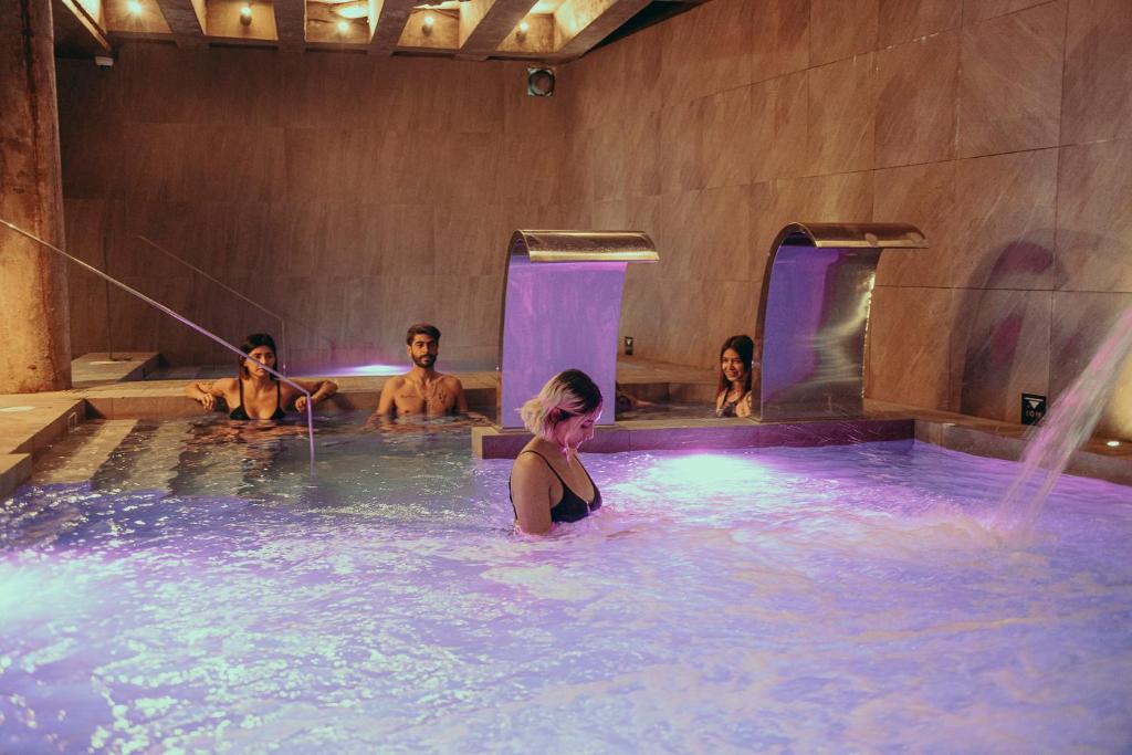 a group of people in a hot tub at Viajero Bogotá Hostel & Spa in Bogotá