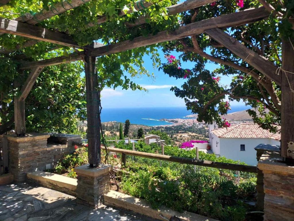a view of the ocean from a pergola at Alba Andros Traditional Villa in Andros