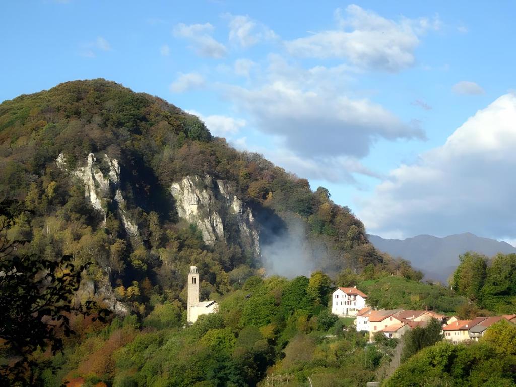 a mountain with a small town on top of it at Casa Fenera in Valduggia