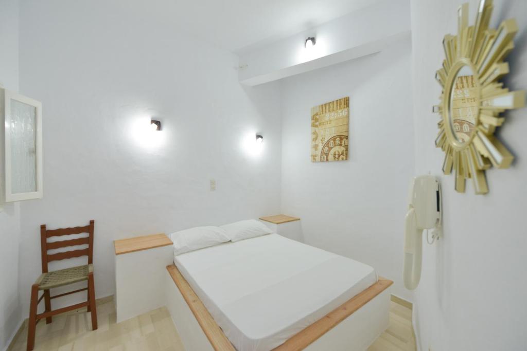 Postel nebo postele na pokoji v ubytování Windmill Villas