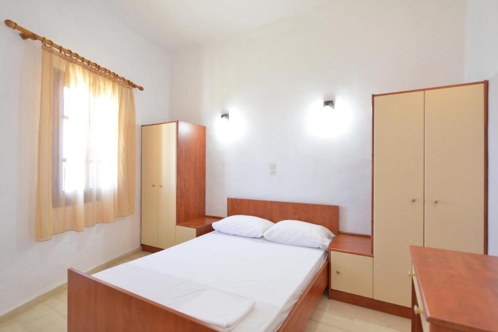 Postel nebo postele na pokoji v ubytování Windmill Villas
