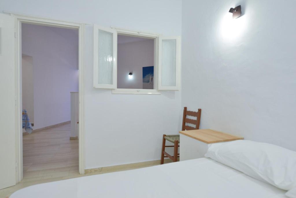 Postel nebo postele na pokoji v ubytování Windmill Villas
