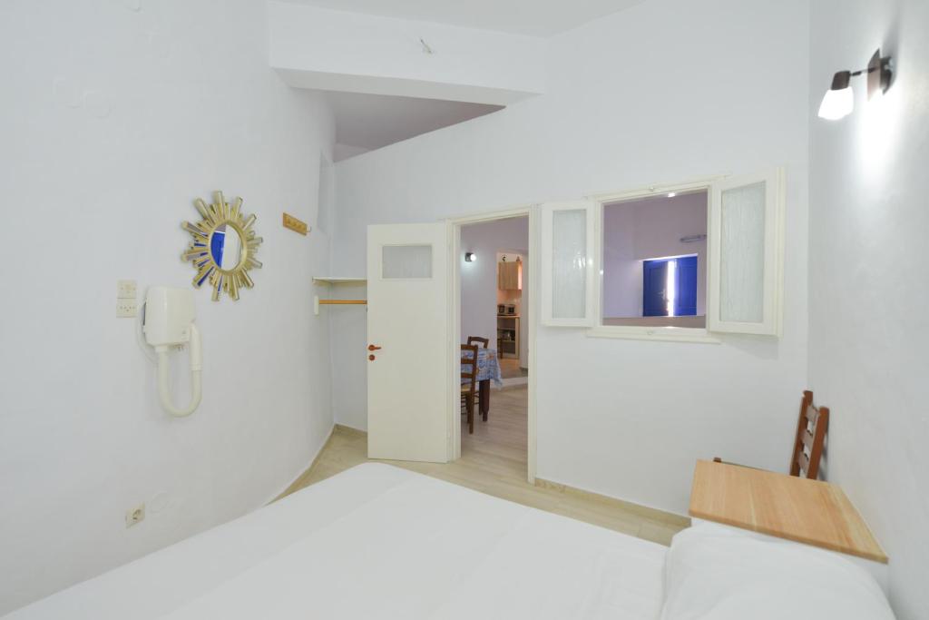 Postel nebo postele na pokoji v ubytování Windmill Villas