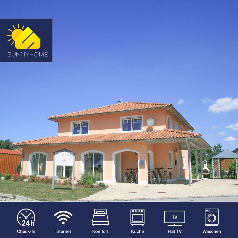 a house for sale with a view of the yard at SUNNYHOME Ferienwohnung am Brückelsee in Wackersdorf