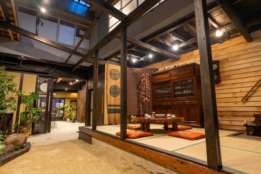 a room with a table in the middle of a building at 尾道つばめ堂 Onomichi Tsubamedo in Onomichi