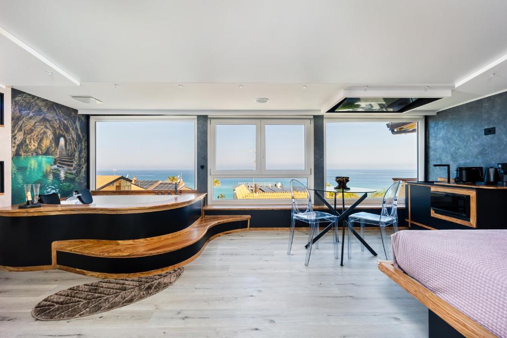 a bedroom with a view of the ocean at Tropea Solemare in Tropea
