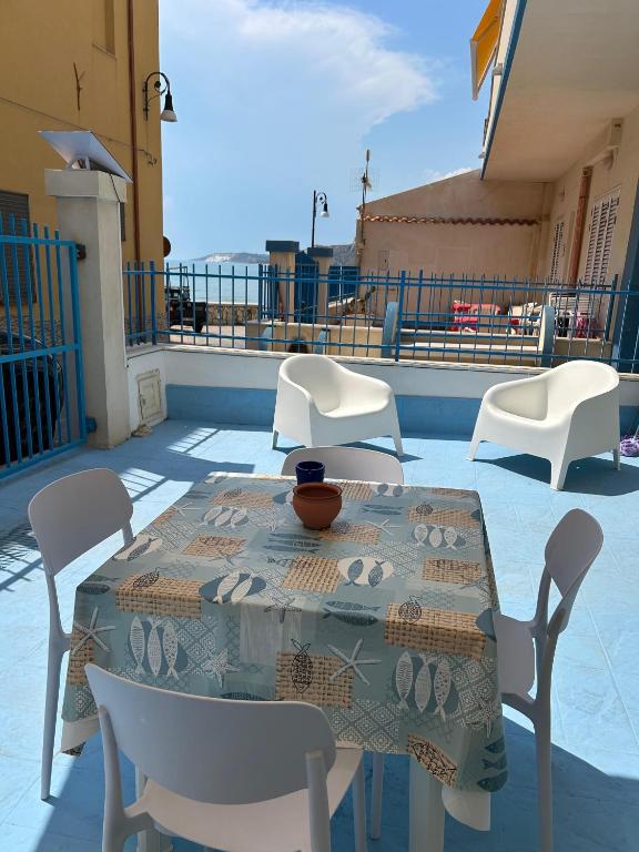 a table and chairs sitting on a patio at Marescià Siculiana Marina in Siculiana