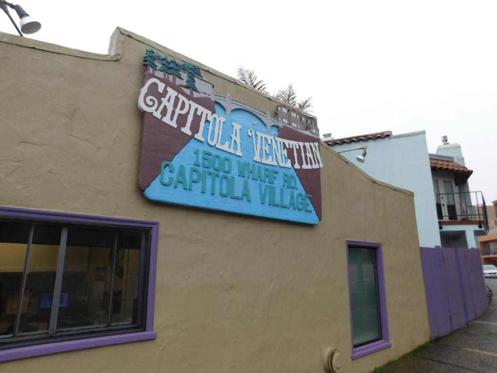 a sign on the side of a building at Capitola Venetian Hotel in Capitola