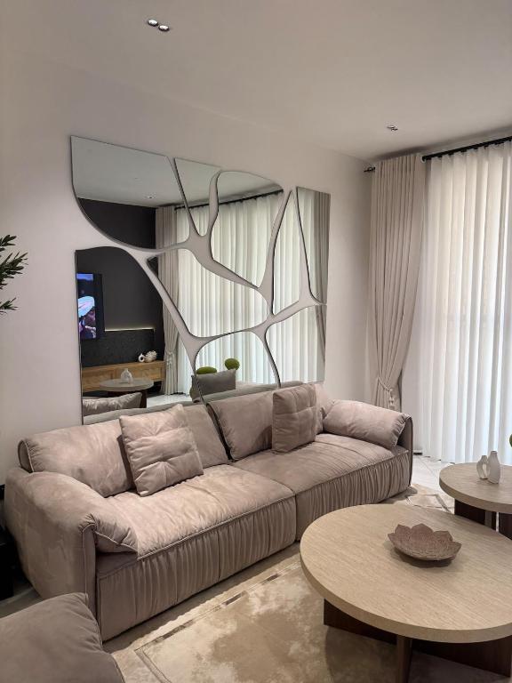 a living room with a couch and a table at Home in Naalya in Kampala