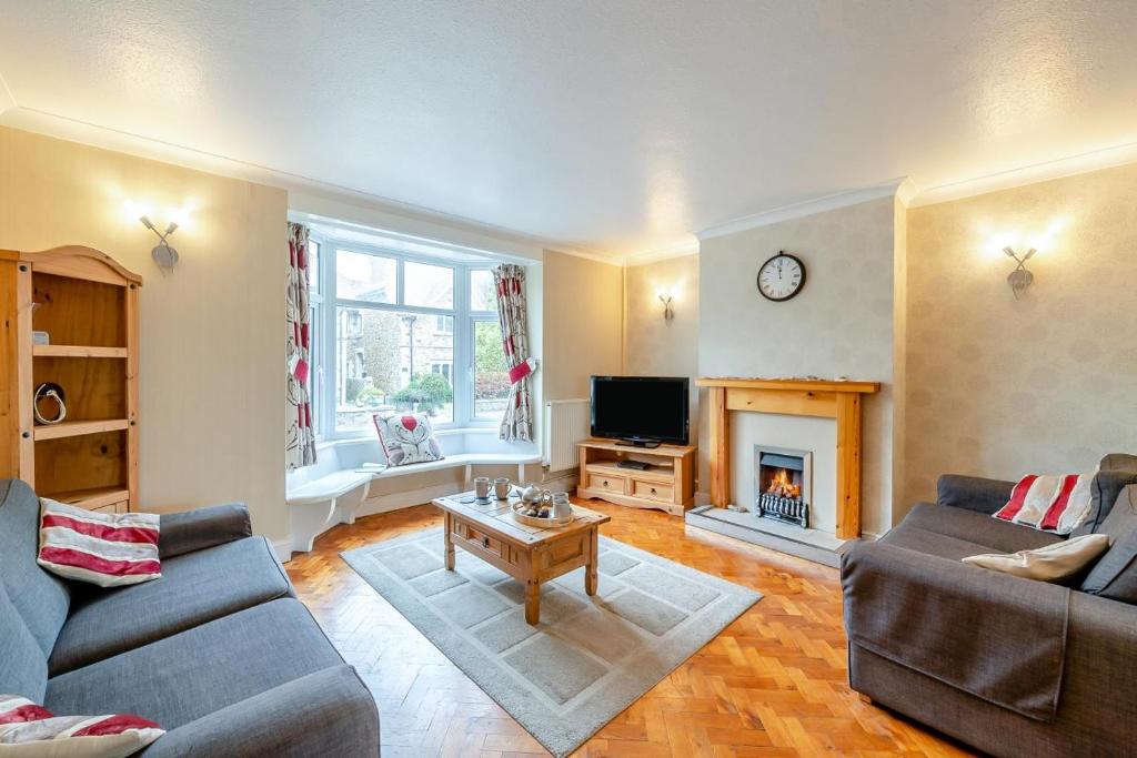 a living room with two couches and a fireplace at 3 Bed in Seaton oc-mbdal in Seaton