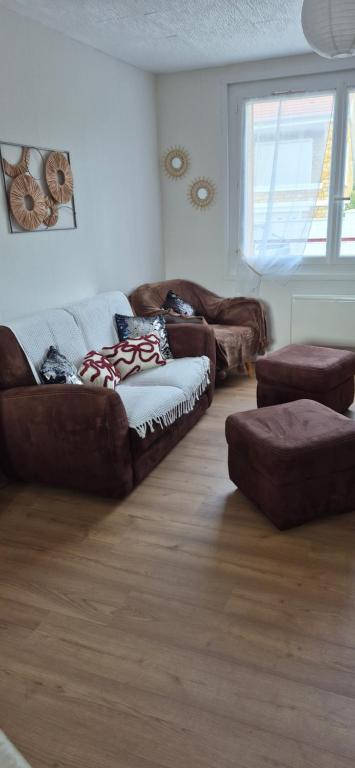 a living room with two couches and a couch at Ma petite maison in Vierzon