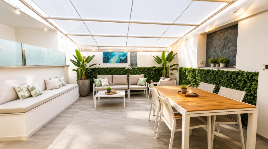 a living room with a couch and a table at Sunrise Apartment by Symphonya Luxury Holiday Rentals in Otranto